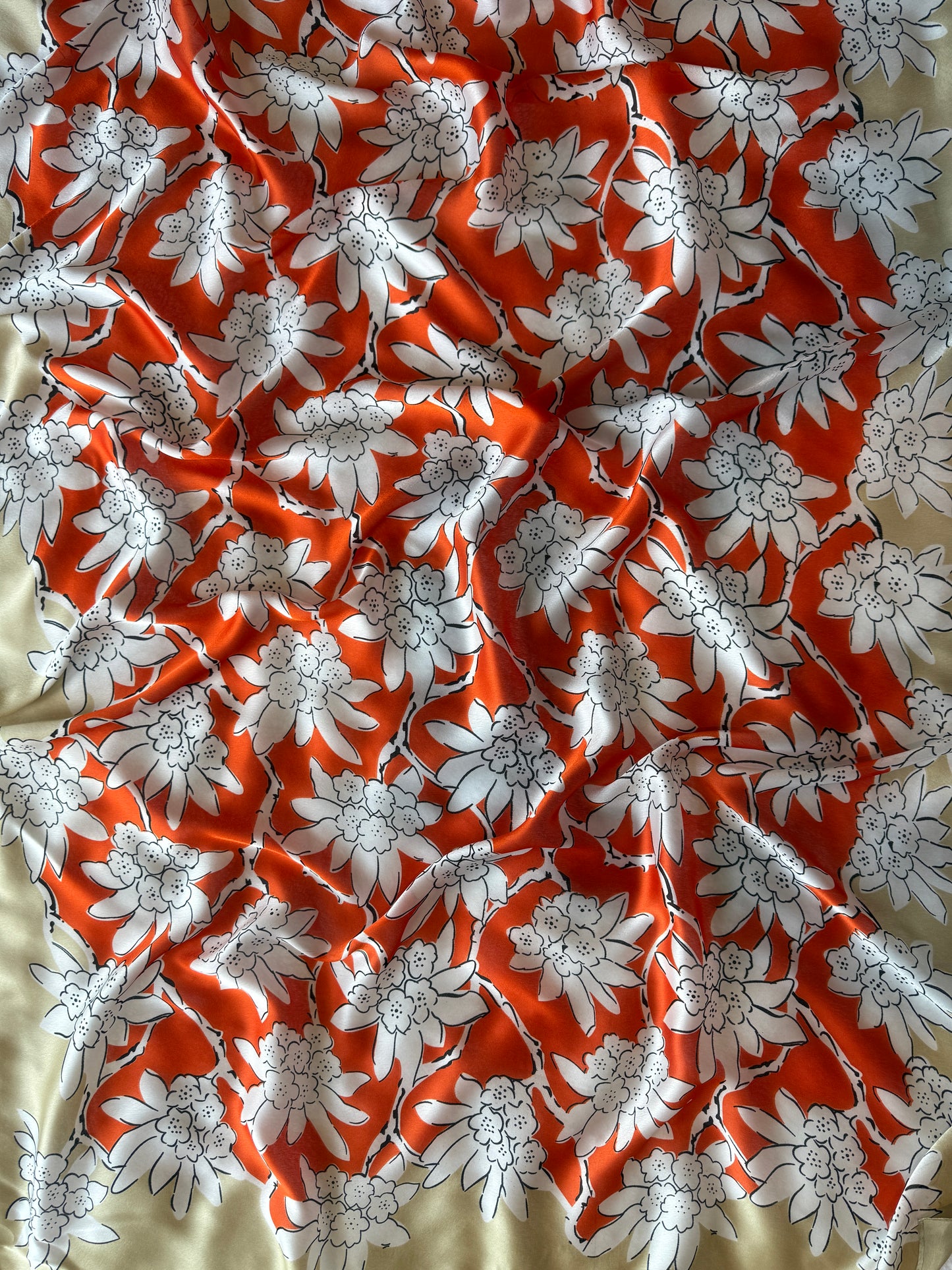 Silk blend scarf with vibrant red-orange floral design on taupe base, nzshawls, scaves in nz, pashmina nz , Women’s scarf, scarves nz, scarfs nz
