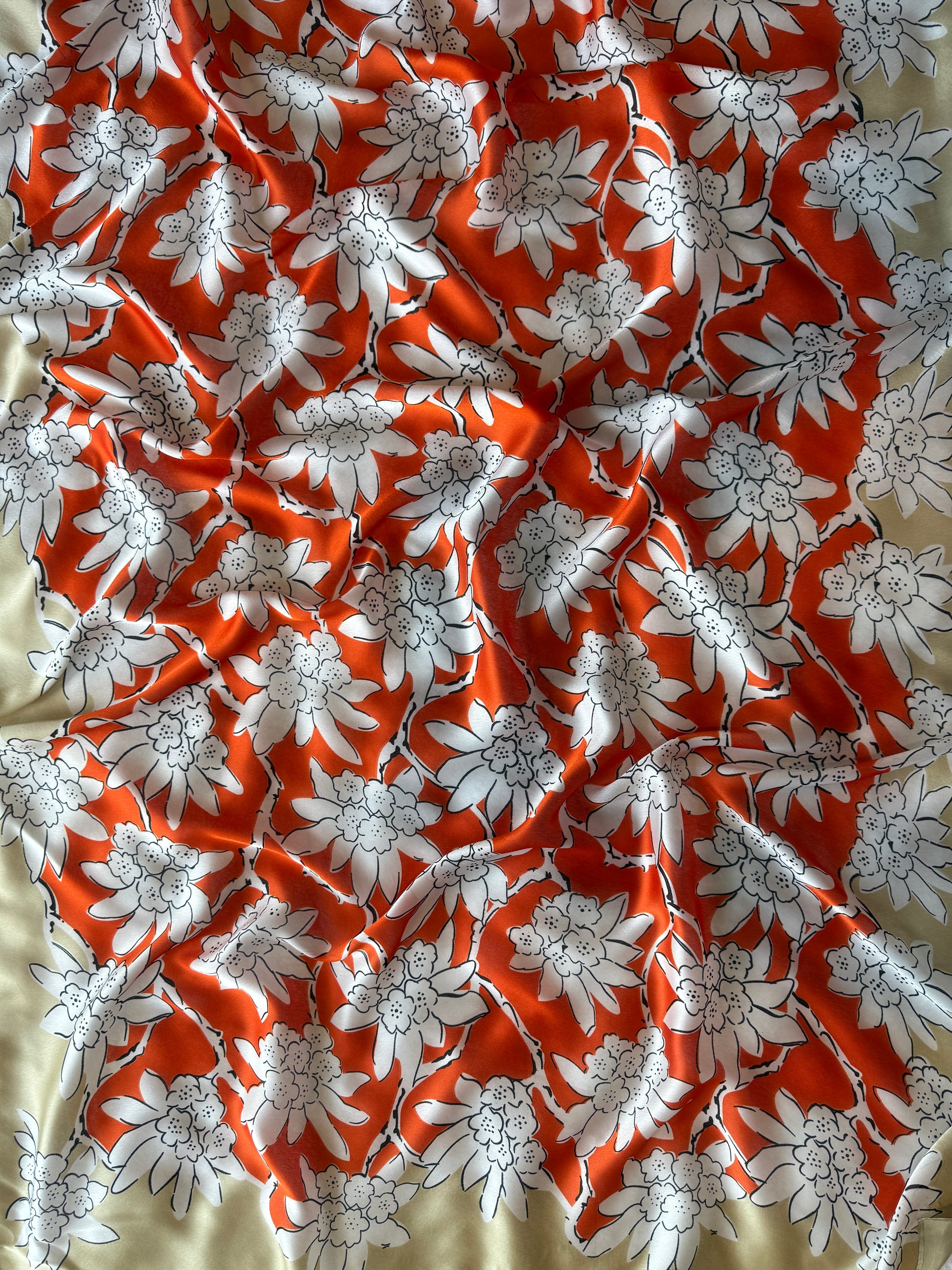 Silk blend scarf with vibrant red-orange floral design on taupe base, nzshawls, scaves in nz, pashmina nz , Women’s scarf, scarves nz, scarfs nz
