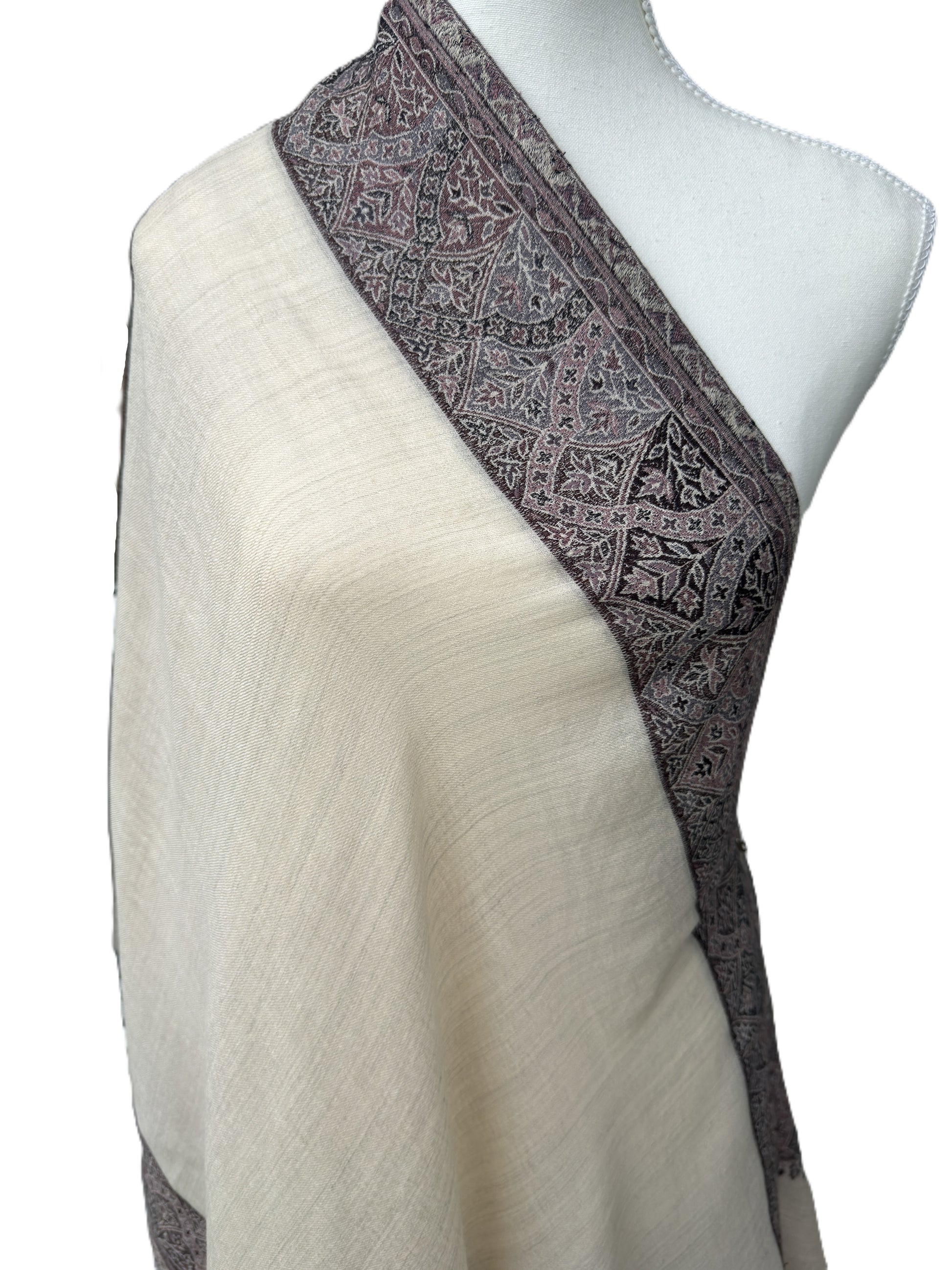 Elegant neutral shawl with intricate paisley design and soft texture